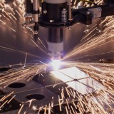 Laser cutting of metal sheets and radial pipe bending